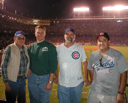 Standing in front of the field before the start of the game.